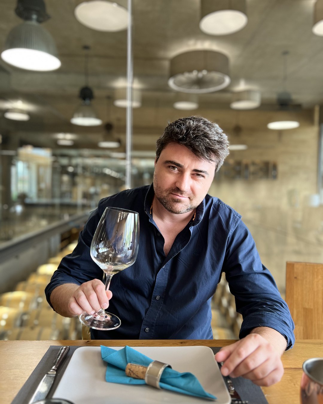 Svetoslav Stoyanov, WSET Diploma candidate, tasting a glass of wine