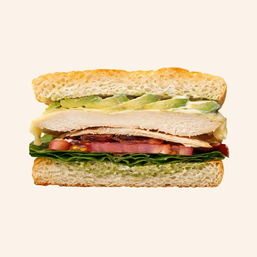 CHICKEN BLT - Housemade organic focaccia, romaine, all natural chicken, candied bacon, tomato, cheddar jack cheese, avocado and ranch dressing. 