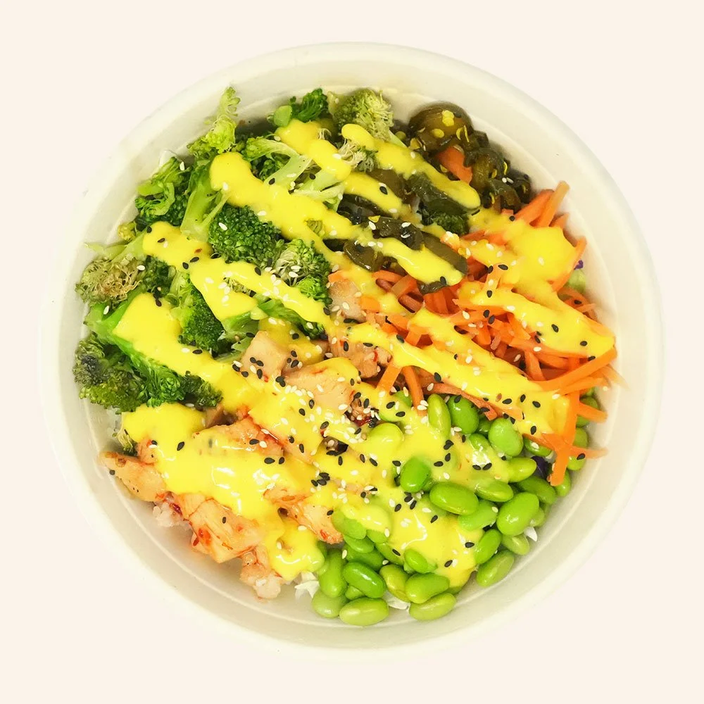 SWEET & SPICY CHICKEN - All-natural chicken, roasted broccoli, edamame,
Jasmine rice, pickled carrots, Carolina slaw, 
sesame seeds, candied jalapenos, turmeric ginger dressing and a Calabrian drizzle.