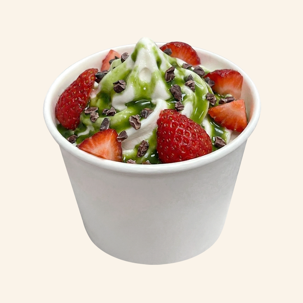 MATCHA BERRY - Superfood soft serve made with organic coconut and vanilla bean, matcha glaze, fresh strawberries, cacoa nibs.