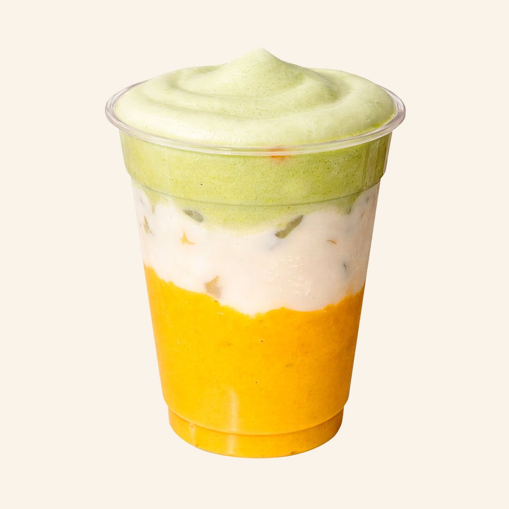 MANGO PEACH - Mango, peach, turmeric, ginger, organic grass milk, coconut matcha cold foam.