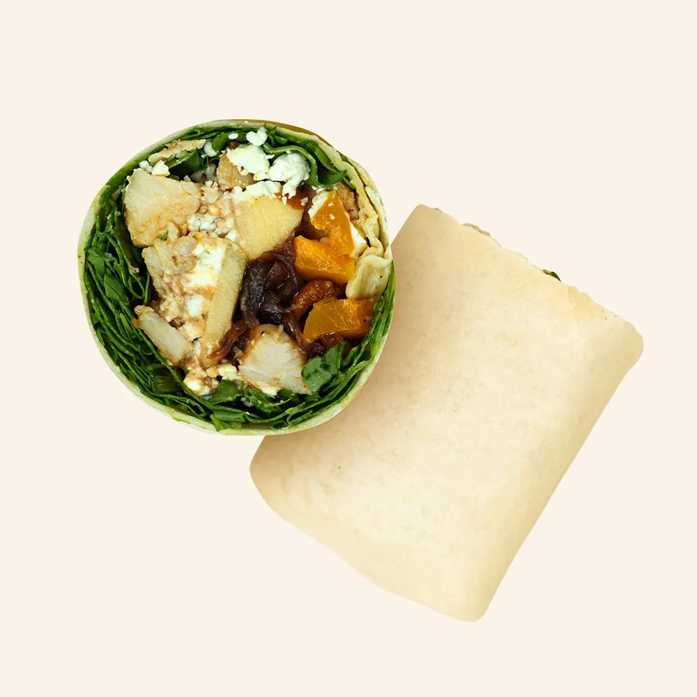 HARVEST CHICKEN - Blackened chicken, goat cheese, arugula, roasted butternut squash, onion apple chutney, candied cashews, maple balsamic vinaigrette in a tortilla.
