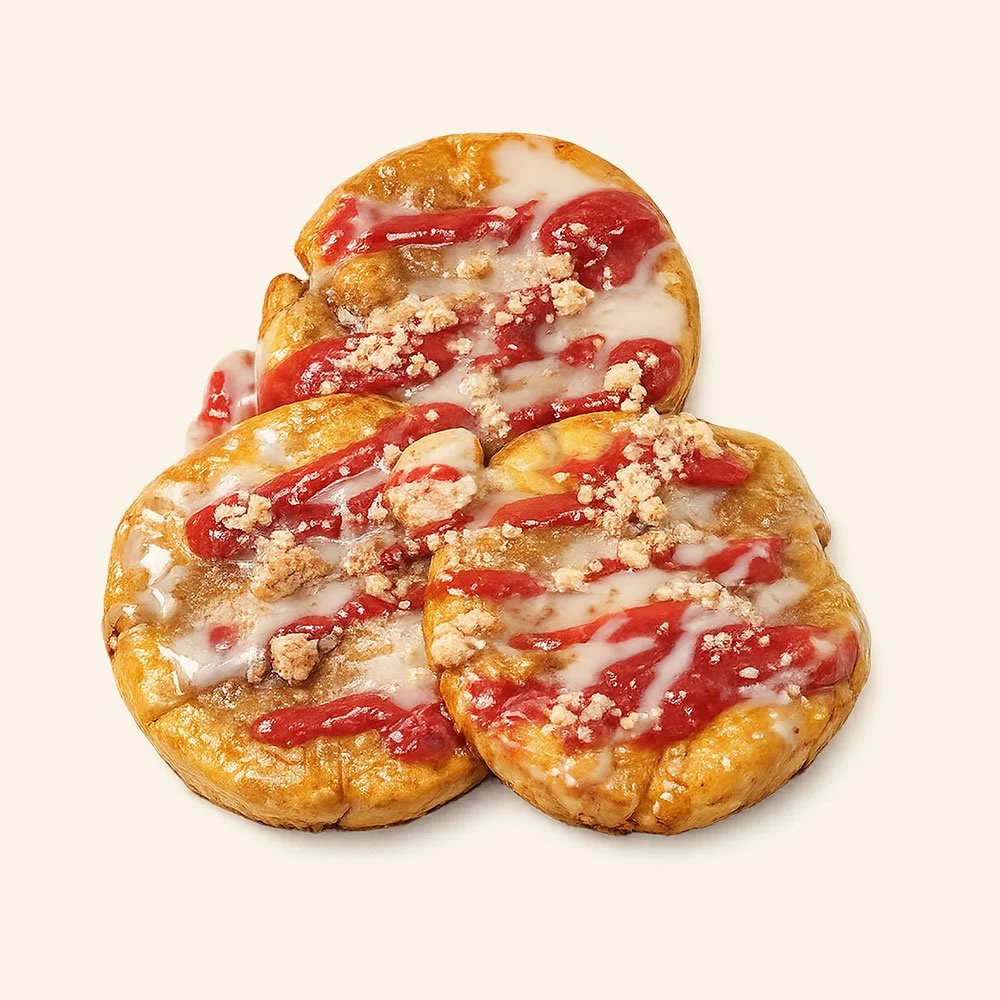 STRAWBERRY STREUSEL PANCAKES - Three gluten free pancakes topped
with a vanilla cinnamon glaze, strawberry compote and a streusel crumble.