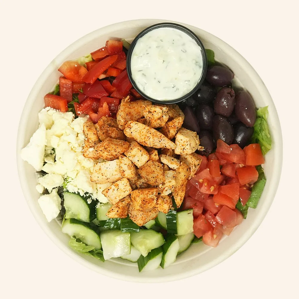 GREEK CHICKEN - All natural blackened chicken, romaine, spring mix, cucumber,
bell peppers, Kalamata olives, tomato,
feta cheese, served with tzatziki.