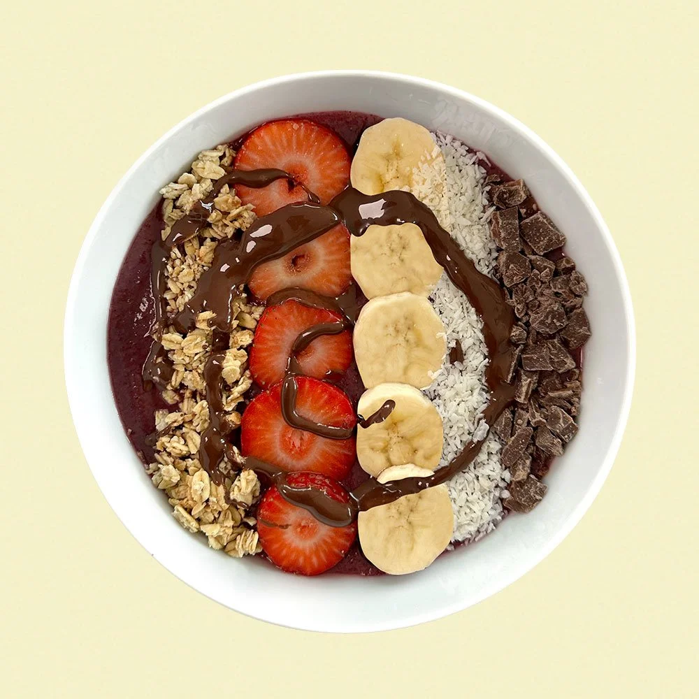 Chocolate Sunset - Organic acai, vegan and organic granola, cacao nibs, strawberries, banana, coconut, nutella drizzle.