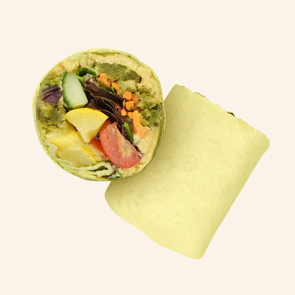 GREEK FALAFEL - Falafel, hummus, spring mix, squash, tomato, cucumber, pickled carrots and Mediterranean red wine in a flour wrap. Contains Gluten