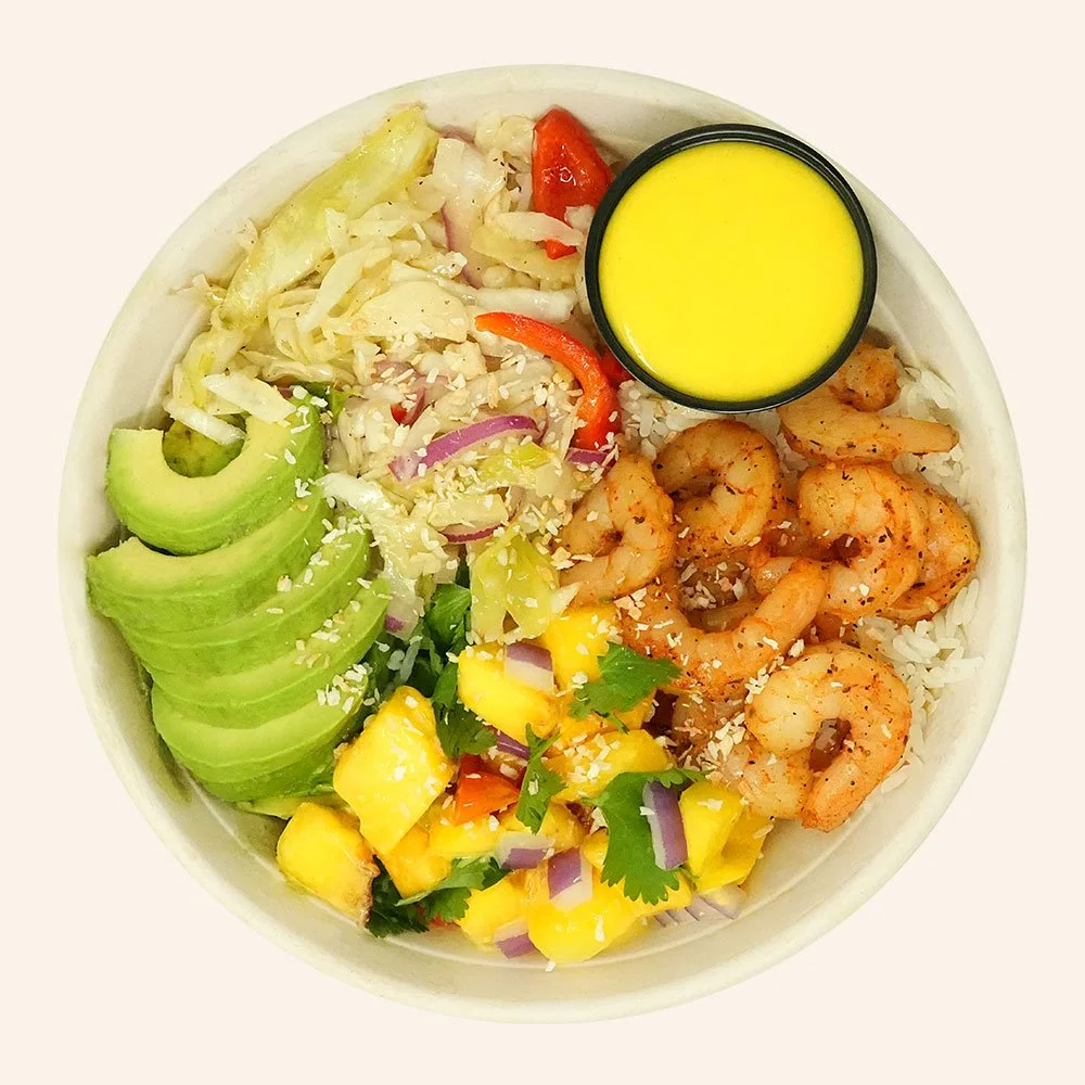 TROPICAL SHRIMP - Blackened shrimp, jasmine rice, avocado peach mango salsa, Carolina slaw, with turmeric ginger dressing, topped with cilantro and toasted coconut. 