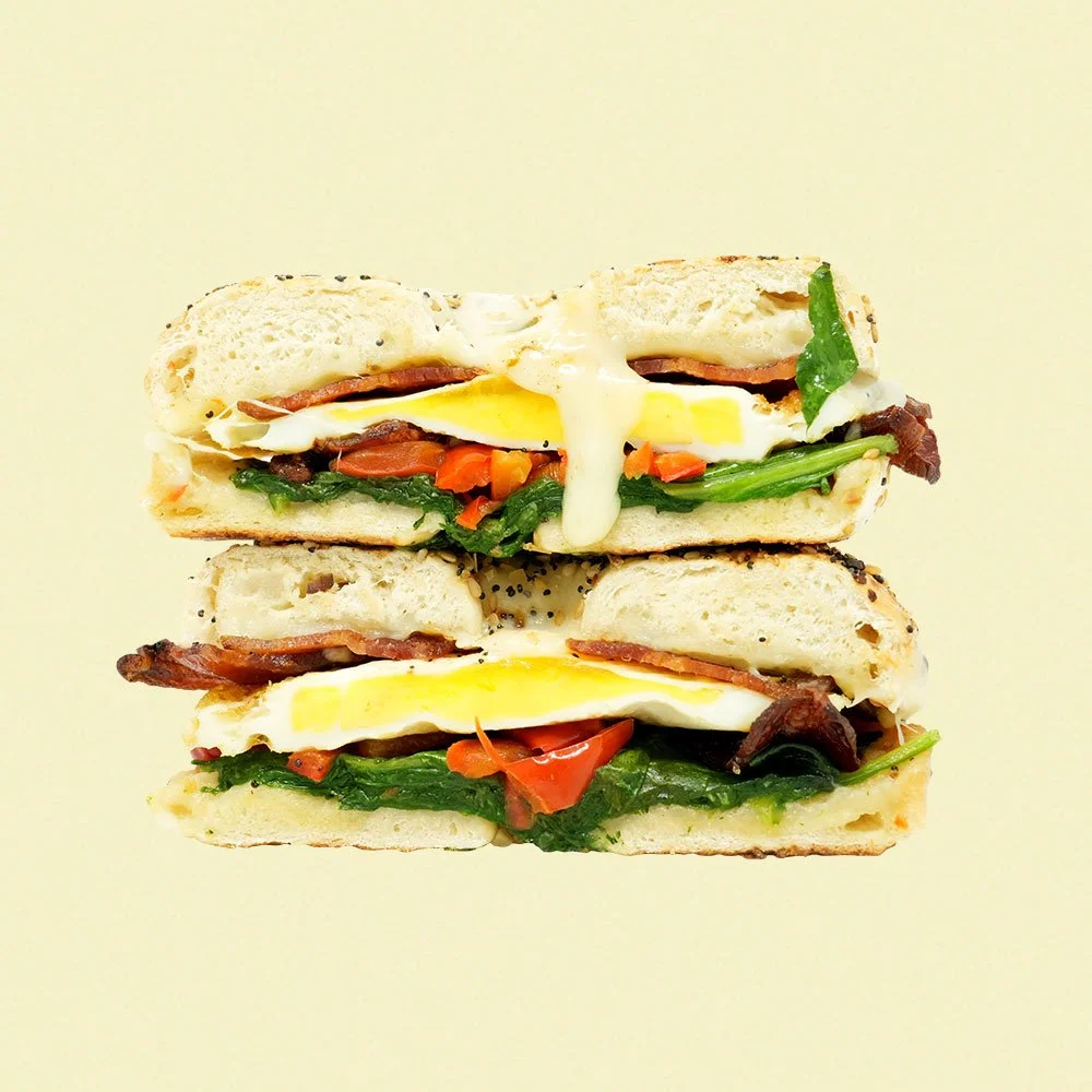 Early Bird Bagel - Baked egg, bacon, spinach,
red pepper, pepperjack cheese
on an everything bagel. Contains Gluten
