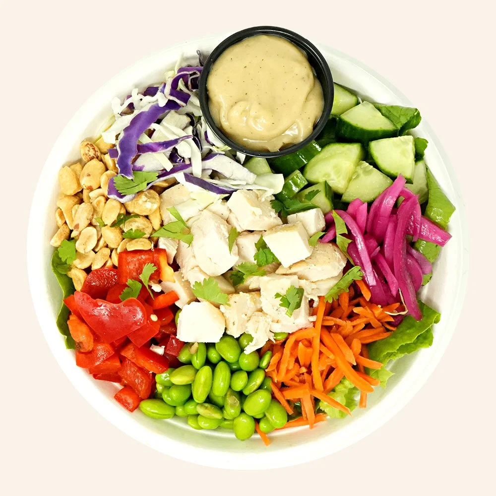 ASIAN CHICKEN - All natural chicken, romaine, cabbage, edamame, pickled onions and carrots, cucumber, bell pepper, cilantro, peanuts, Asian sesame ginger dressing.