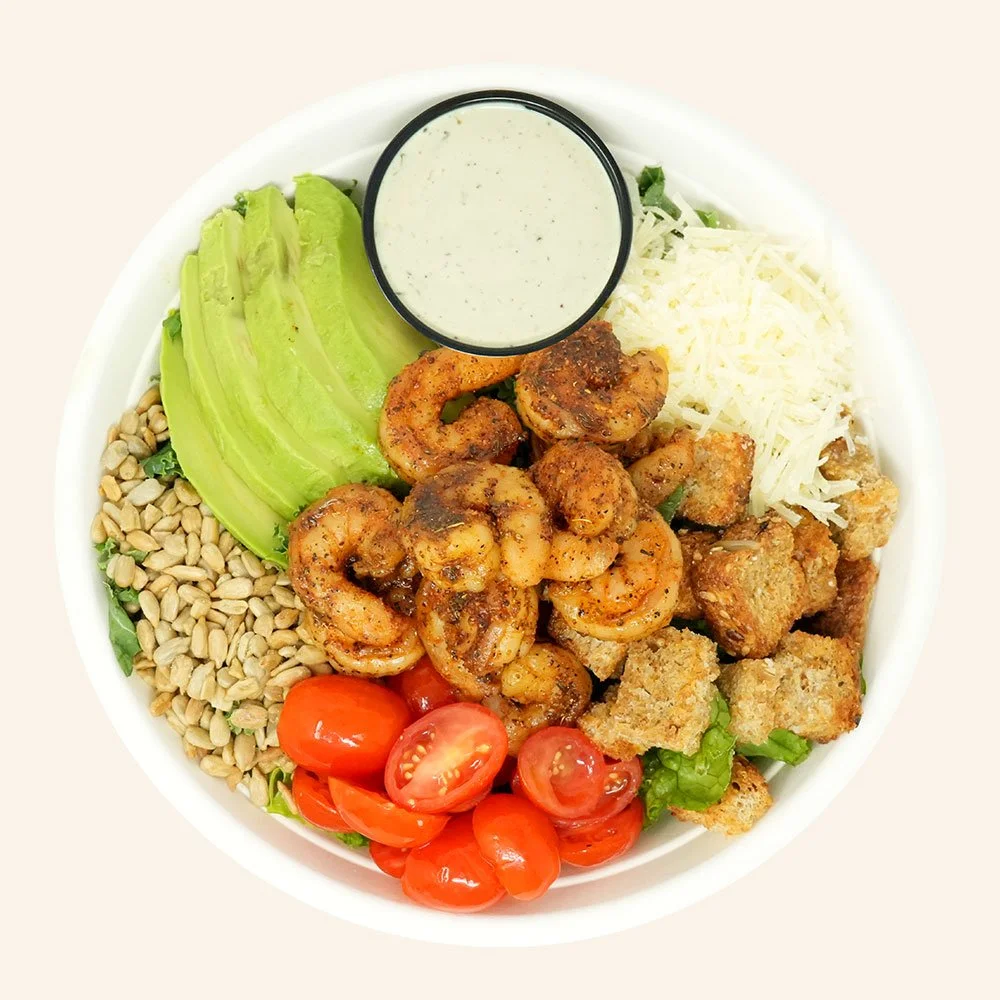 SHRIMP CAESAR - Blackened shrimp, romaine, tomato,  sunflower seeds, parmesan cheese, gluten free croutons, avocado served with caesar dressing.