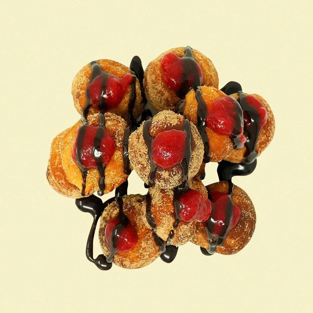 Donut Bites - Cinnamon dusted gluten free protein donut bites, with a housemade chocolate drizzle and berry compote.