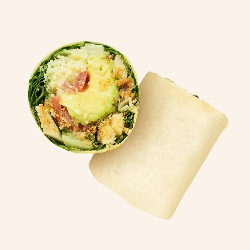 CHICKEN CAESAR - All natural chicken, gluten free crushed croutons, romaine, parmesan cheese, tomato, avocado, bacon,
caesar dressing in a tortilla.