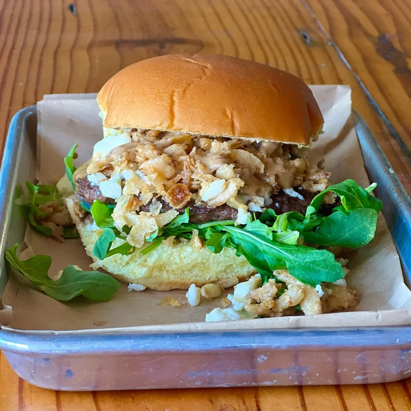 Burger of the month: 
&ldquo;Black &amp; Blue&rdquo;  Beef patty, black garlic aioli, blue cheese, crispy fried onions and arugula on a potato bun