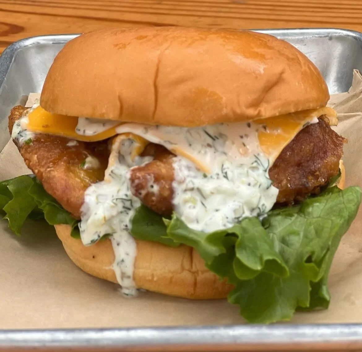 Come and get it before it&rsquo;s gone!
&ldquo;Cod Almighty!&rdquo;
Battered cod, tartar sauce, American cheese and lettuce on a potato roll.