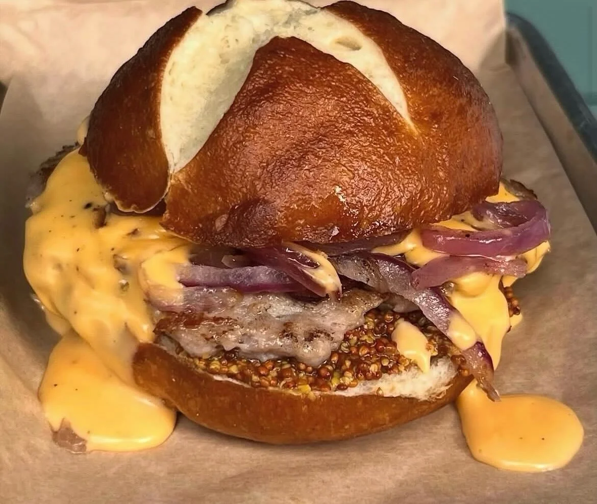 It&rsquo;s that time of year! The Fest burger is back! &ldquo;Oktoberfest Burger&rdquo; 
Bratwurst seasoned pork patty with wholegrain mustard, caramelized onions topped with beer cheese on a pretzel bun.