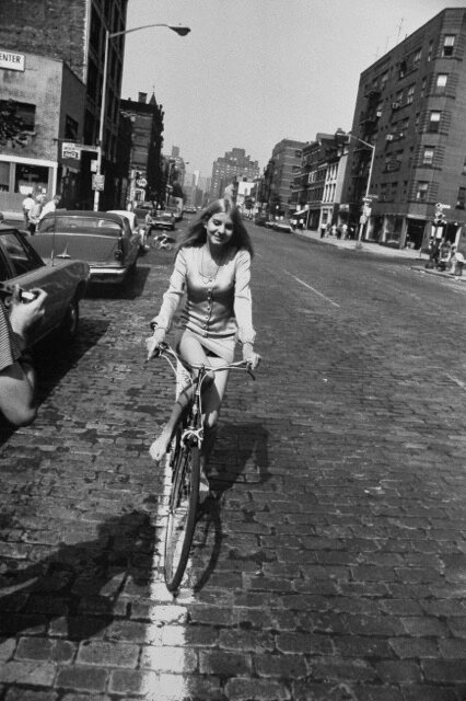 Garry Winogrand, Woman Riding Bicycle (from Women are Beautiful Portfolio), 1975 Gelatin silver print