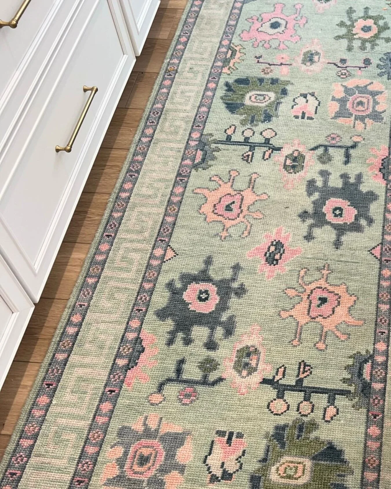 Early morning light on this fun custom rug! 

The pattern, colors and layout were all carefully selected to incorporate the adjoining rooms fabrics, colors and patterns to create continuity throughout the home. 

I call this establishing your color s