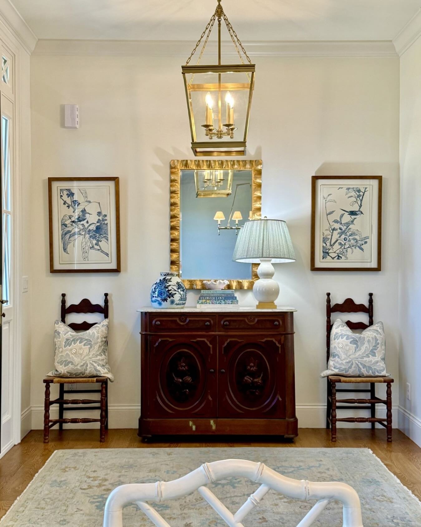 The secret to a welcoming home isn&rsquo;t buying everything new. It&rsquo;s the mix of layering pieces that tell a story.

A cherished family antique, a playful mirror, and pillows that pull color from the rug create a space that feels collected, pe