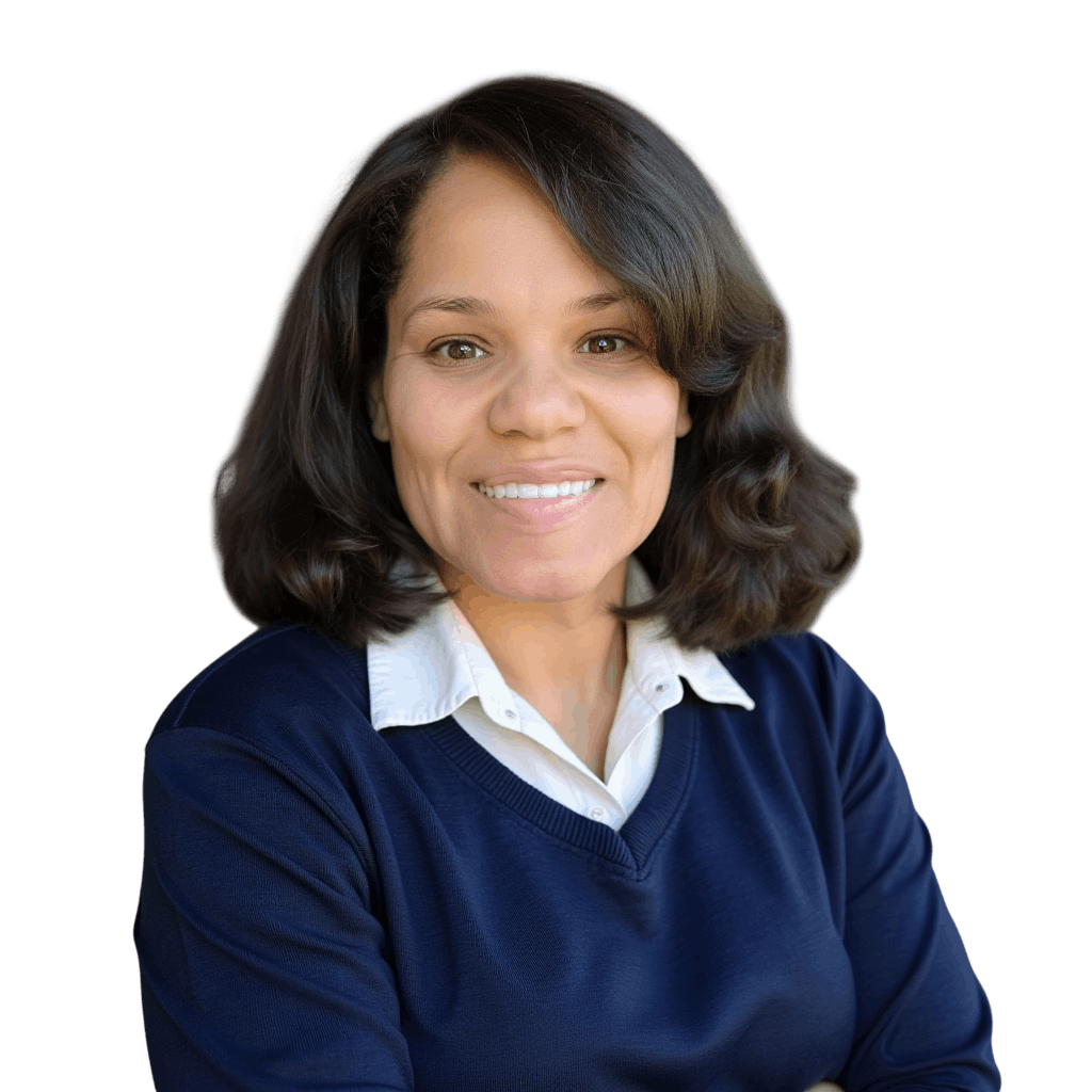 A woman with shoulder-length brown hair wearing a white collared shirt and navy blue sweater, smiling at the camera.