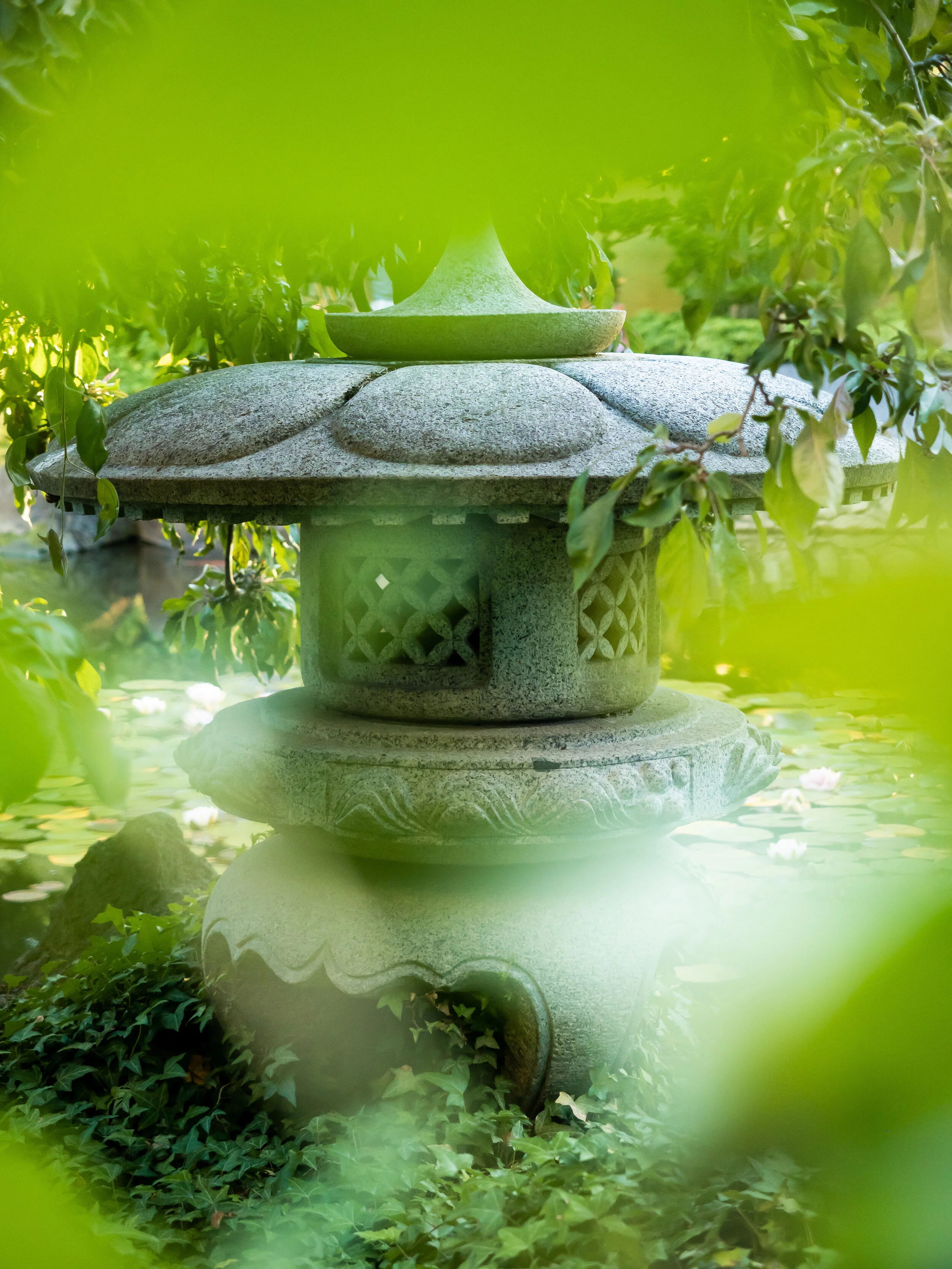 Here is another stone structure in the garden creatively composed with foreground blur to make it more interesting. ISO 640 / 1/400 sec / f/2.8