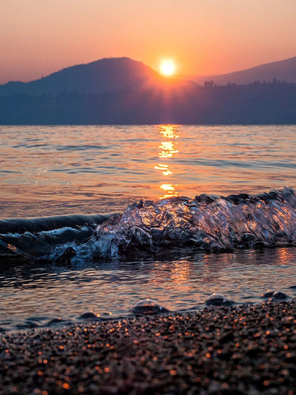 gyro beach in kelowna at sunset