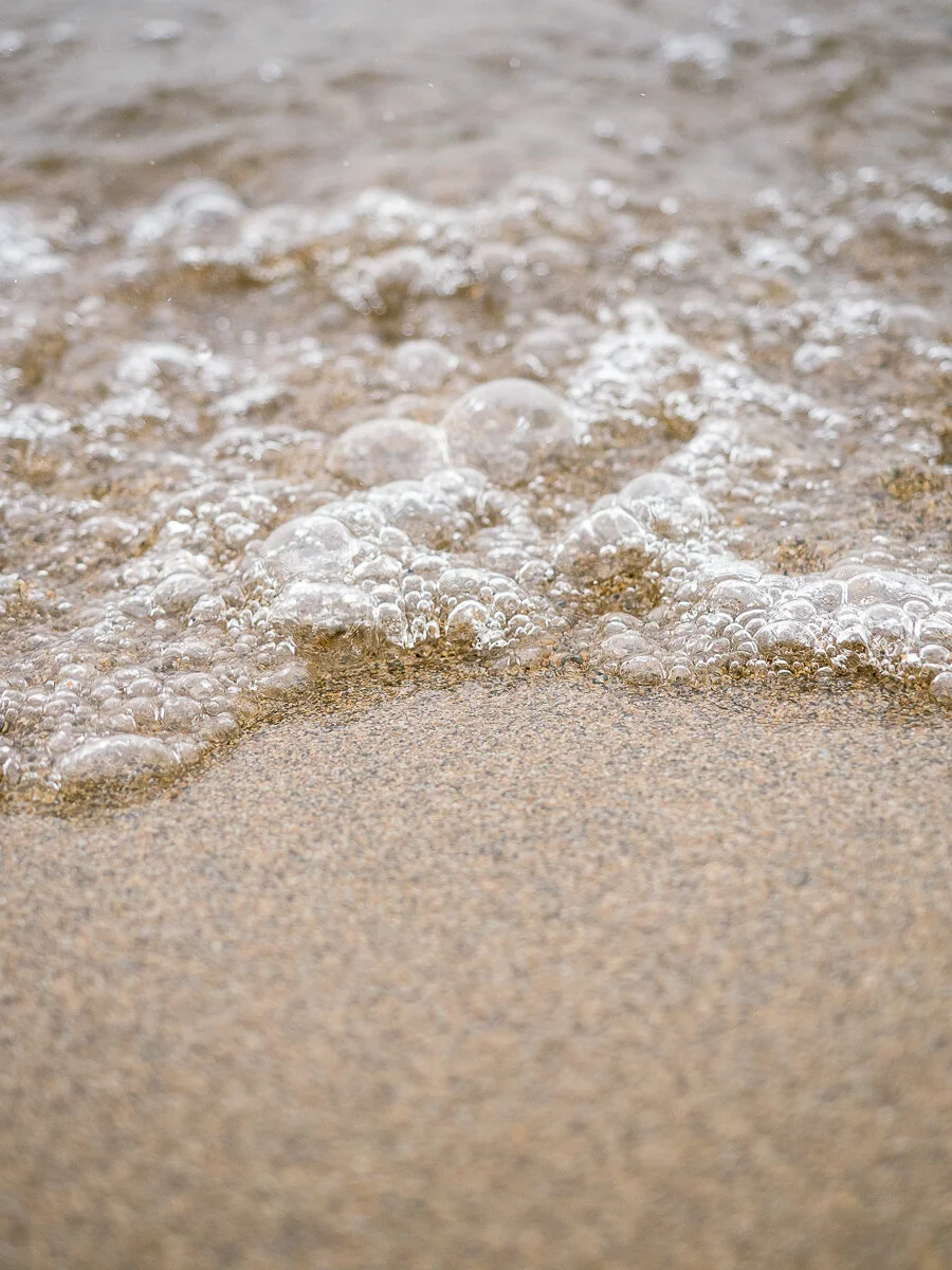 This photo was also taken at Gyro Beach and I loved the spherical bubbles that would sometimes form and the line that was drawn in the sand when the wave would come in.