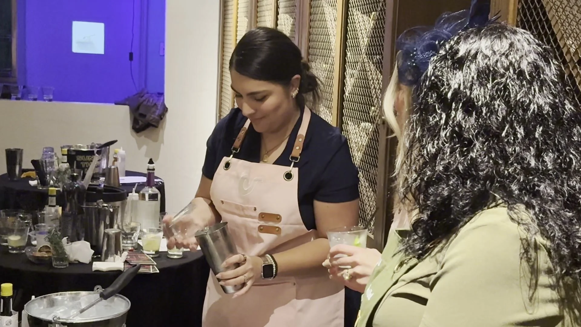 Bartender shaking and pouring a cocktail