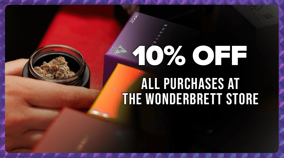 A person holds a jar containing cannabis buds in front of a Wonderbrett store sign offering 10% off all purchases.