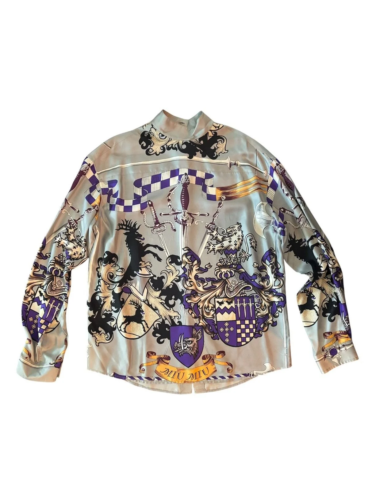 Miu Miu    2018 — Released as part of their reedition campaign; originally released in 2006.   Coat of Arms Button-Up  Size 42