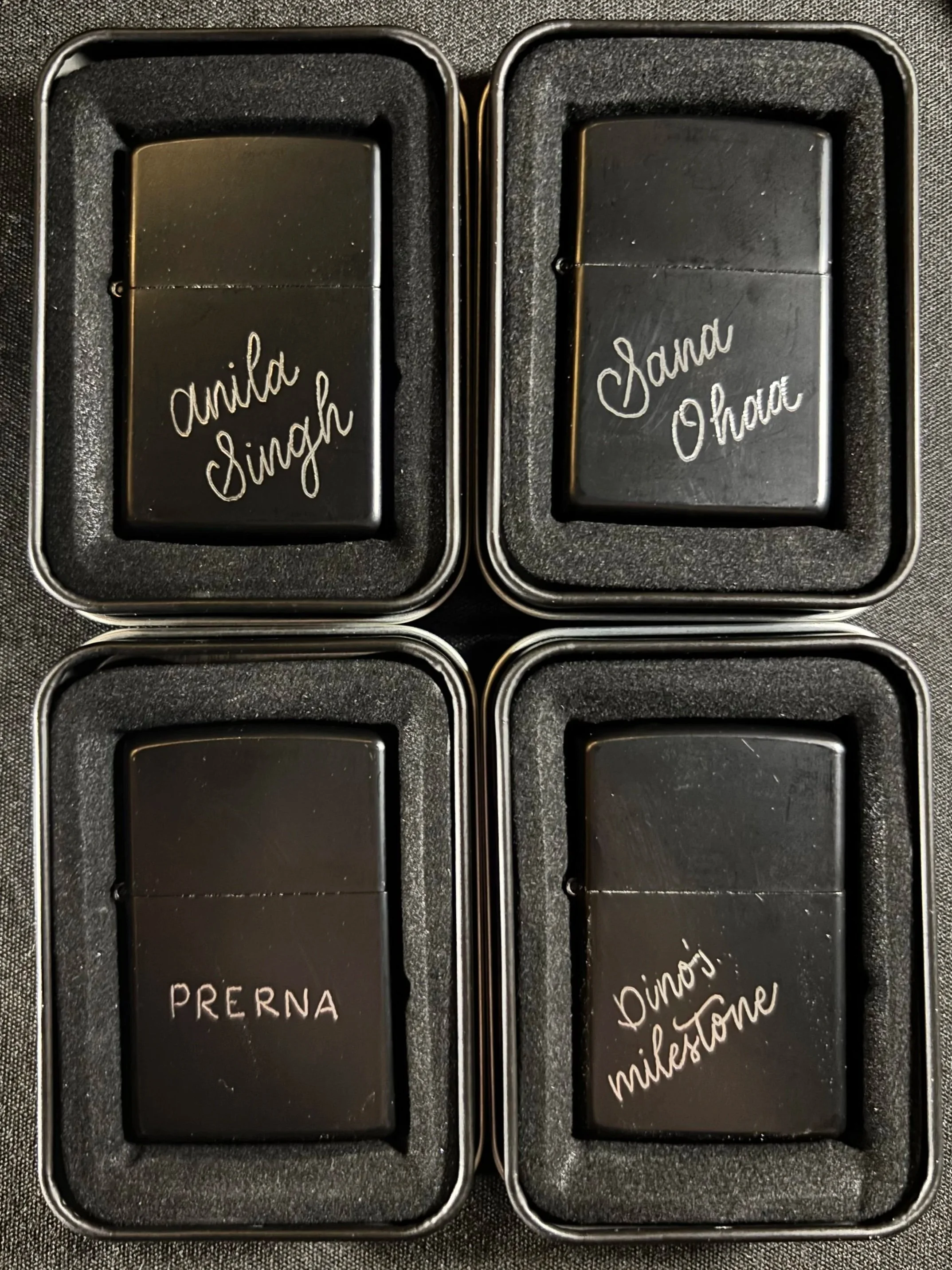 black lighters with hand engraved calligraphy created for a birthday party