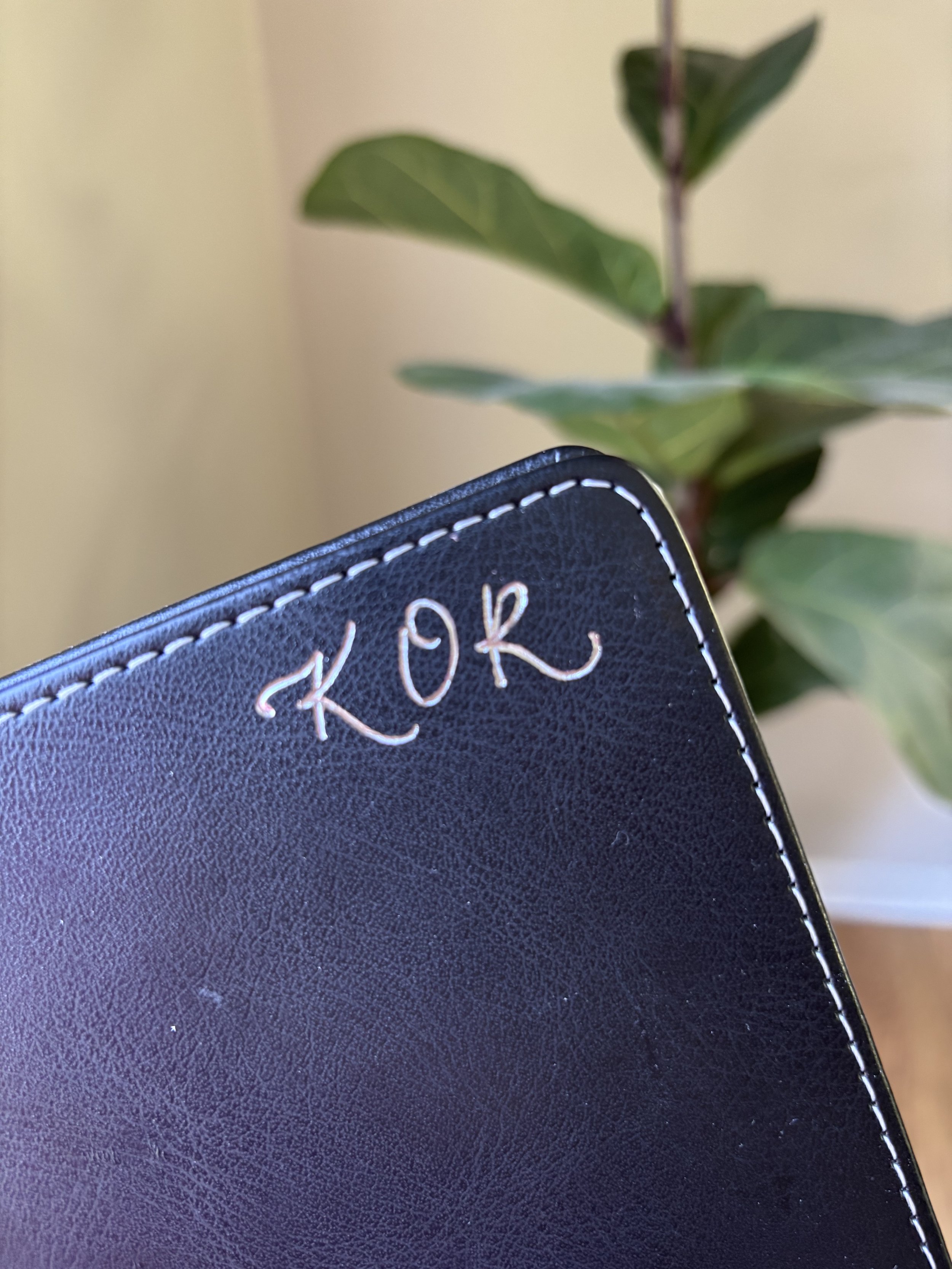 calligraphy initials heat foiled on leather notebook
