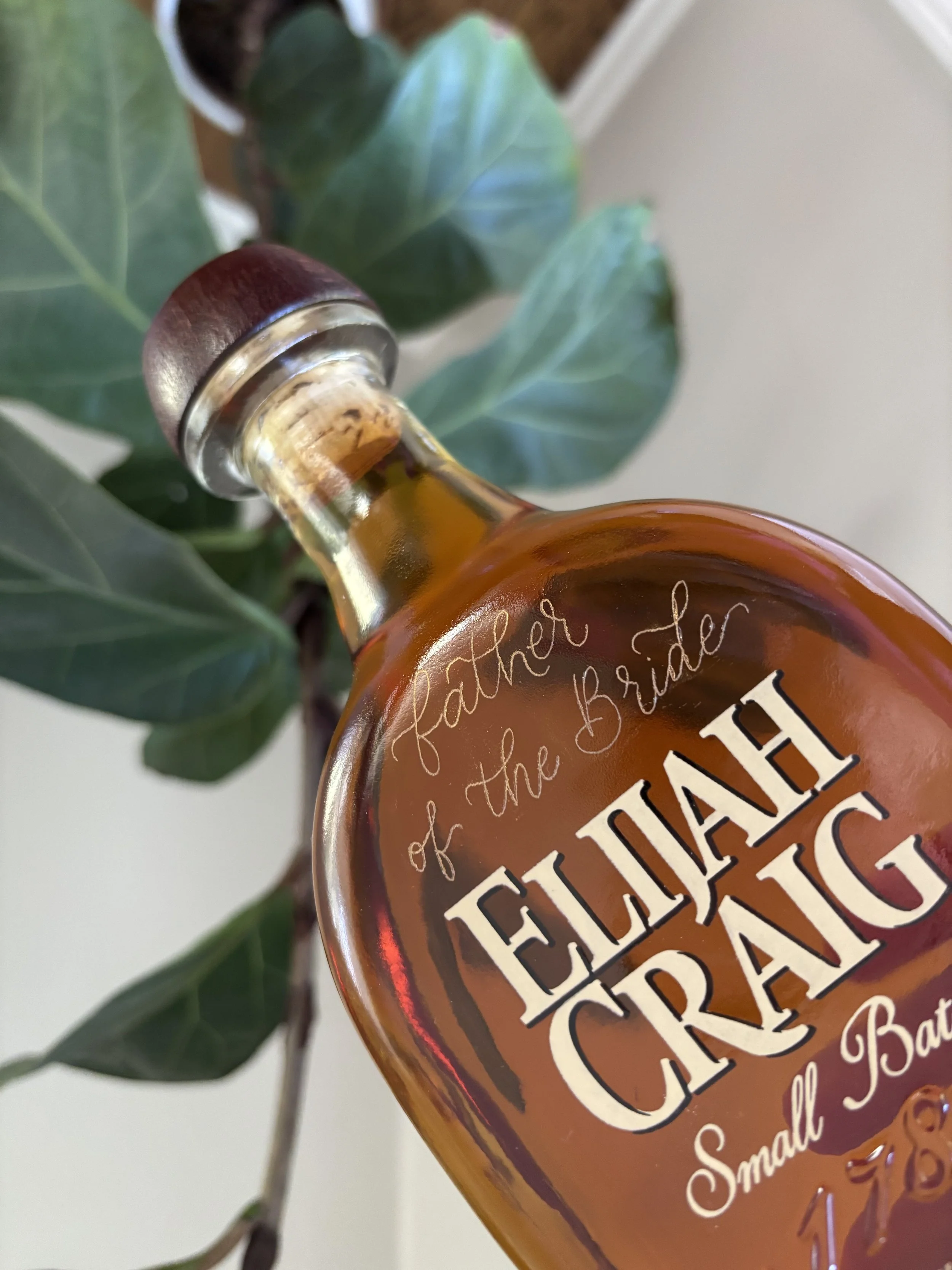 father of the bride engraved in calligraphy on spirit bottle