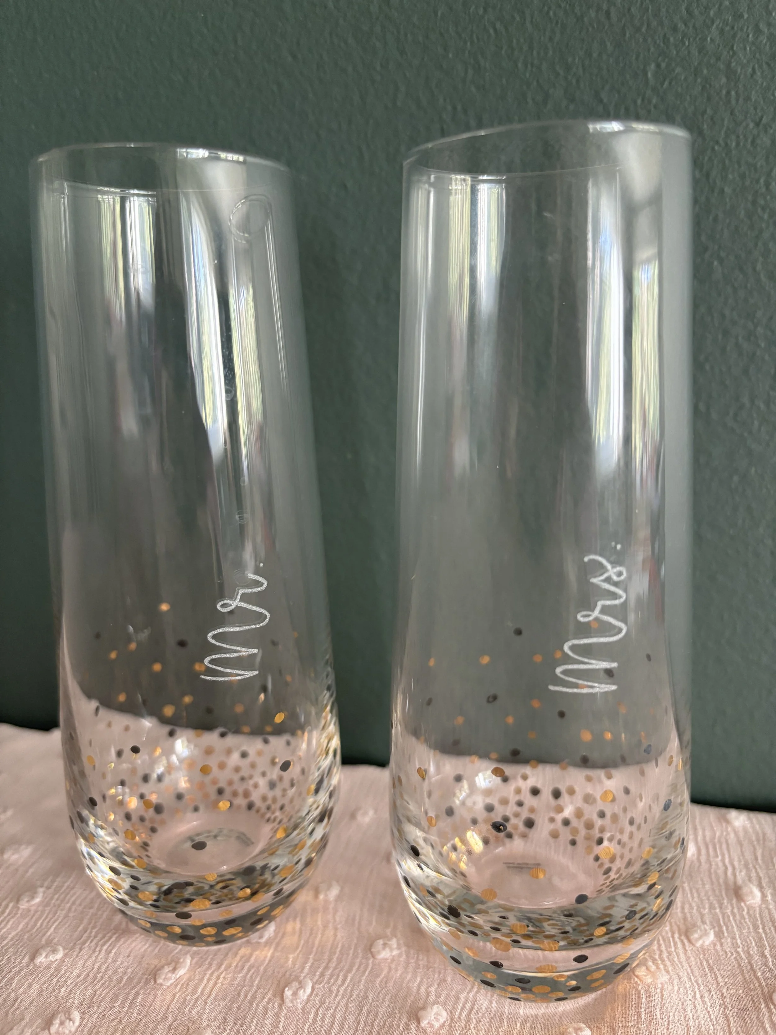 mr and mrs hand engraved in calligraphy on wine glasses
