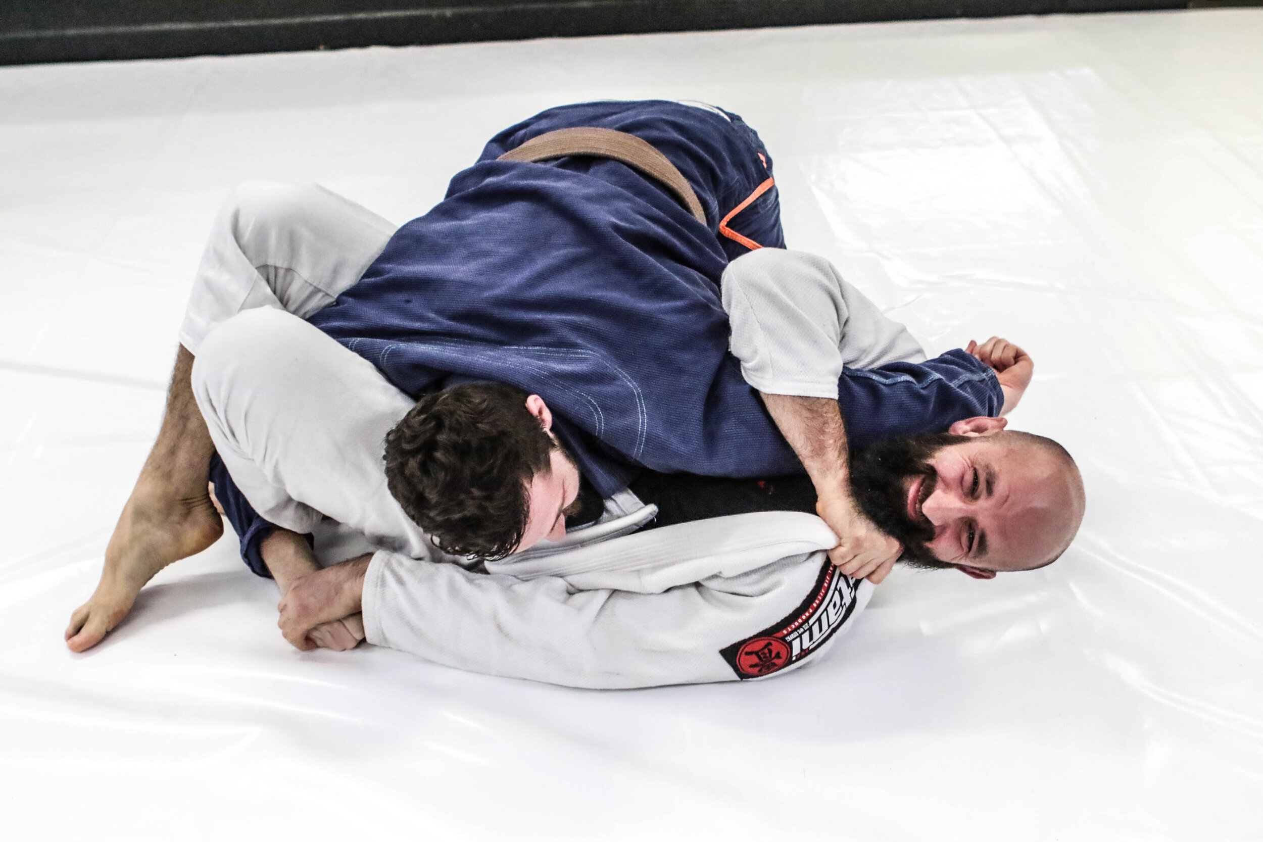 2 BJJ students sparring 