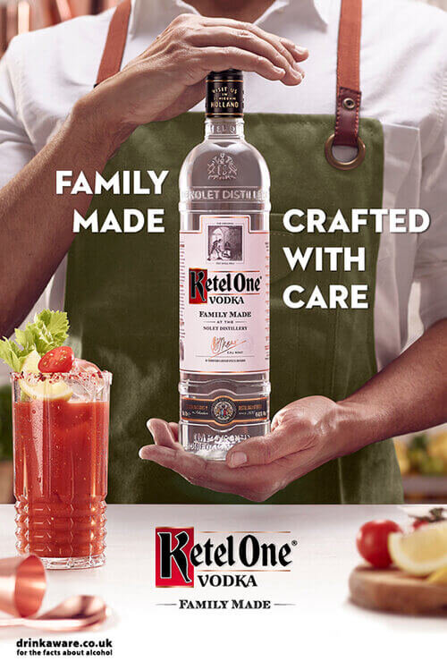 Ketel One bartender with bottle and serve