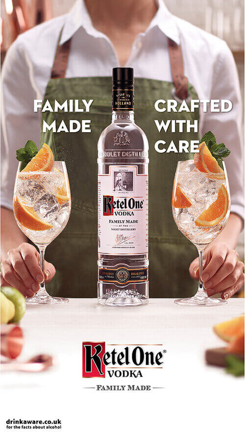 Ketel One bartender with bottle and serve