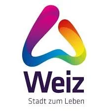 Farbenfrohes Logo mit dem Text 'Weiz Stadt zum Leben'