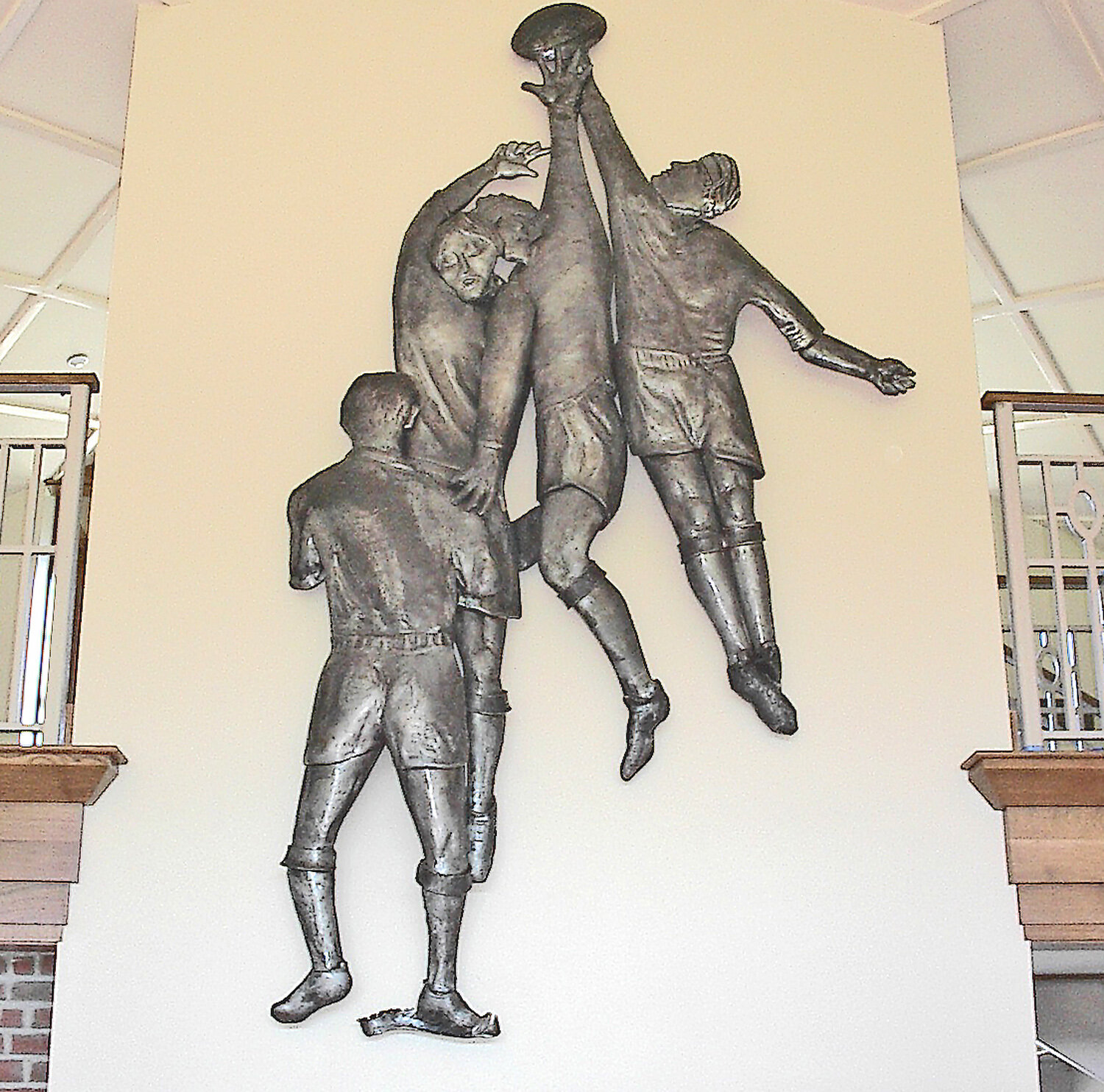 RUGBY LINEOUT RELIEF SCULPTURE by Dimitri Gerakaris at Dartmouth College