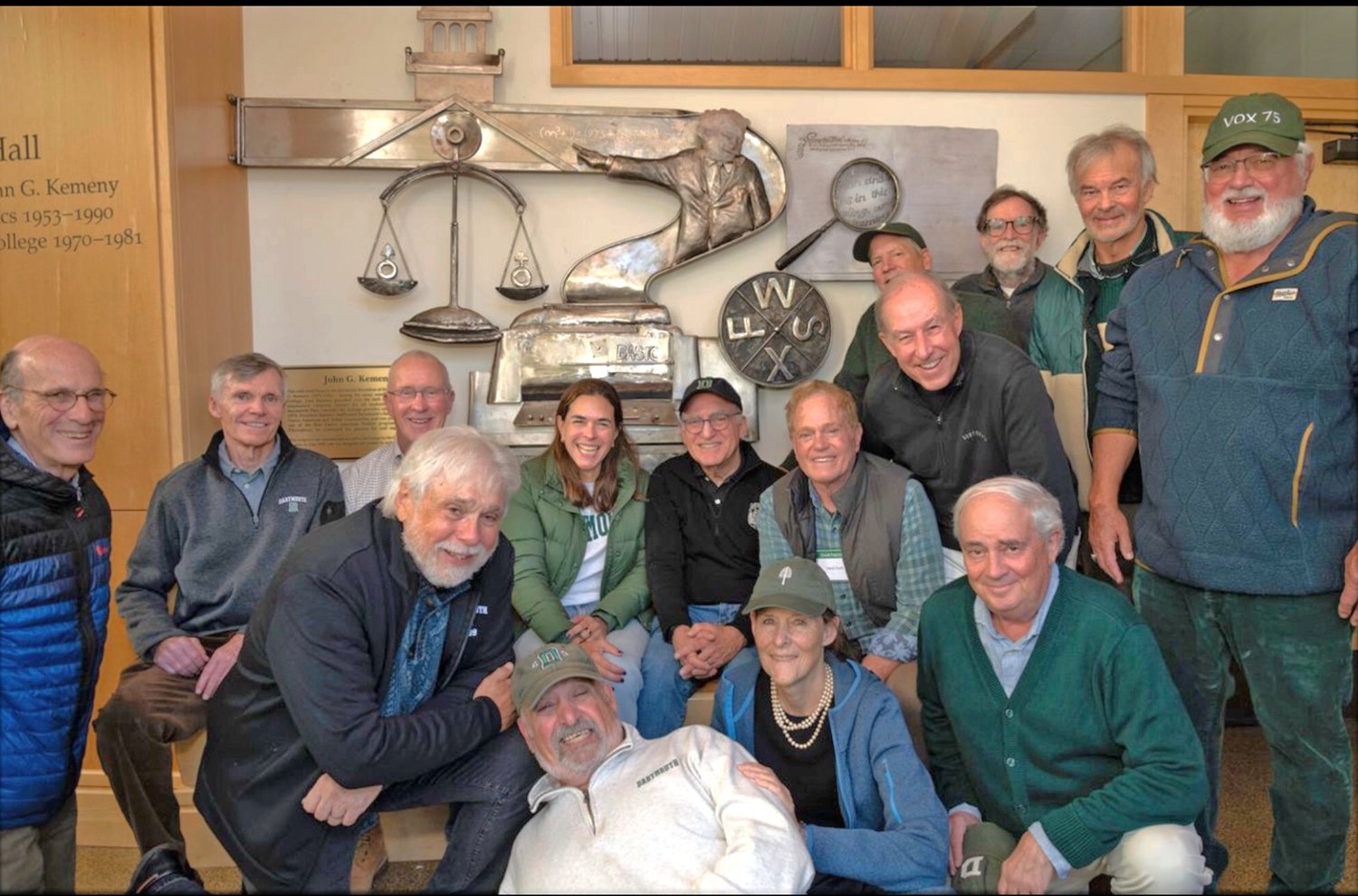  Some of the sculpture’s sponsoring Dartmouth Class of 1975 at the dedication of the artwork by Dartmouth President Sian Beilock, top center, and with artist Dimitri Gerakaris, bottom center. 