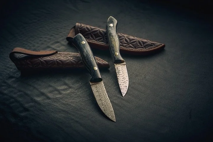 Gunsmoke &amp; Stagecoach | a pairing just meant to be. 

Handled in stabilised giraffe bone, this pair are crafted from Damasteel - a patterned stainless steel highly performing in both utility and looks.