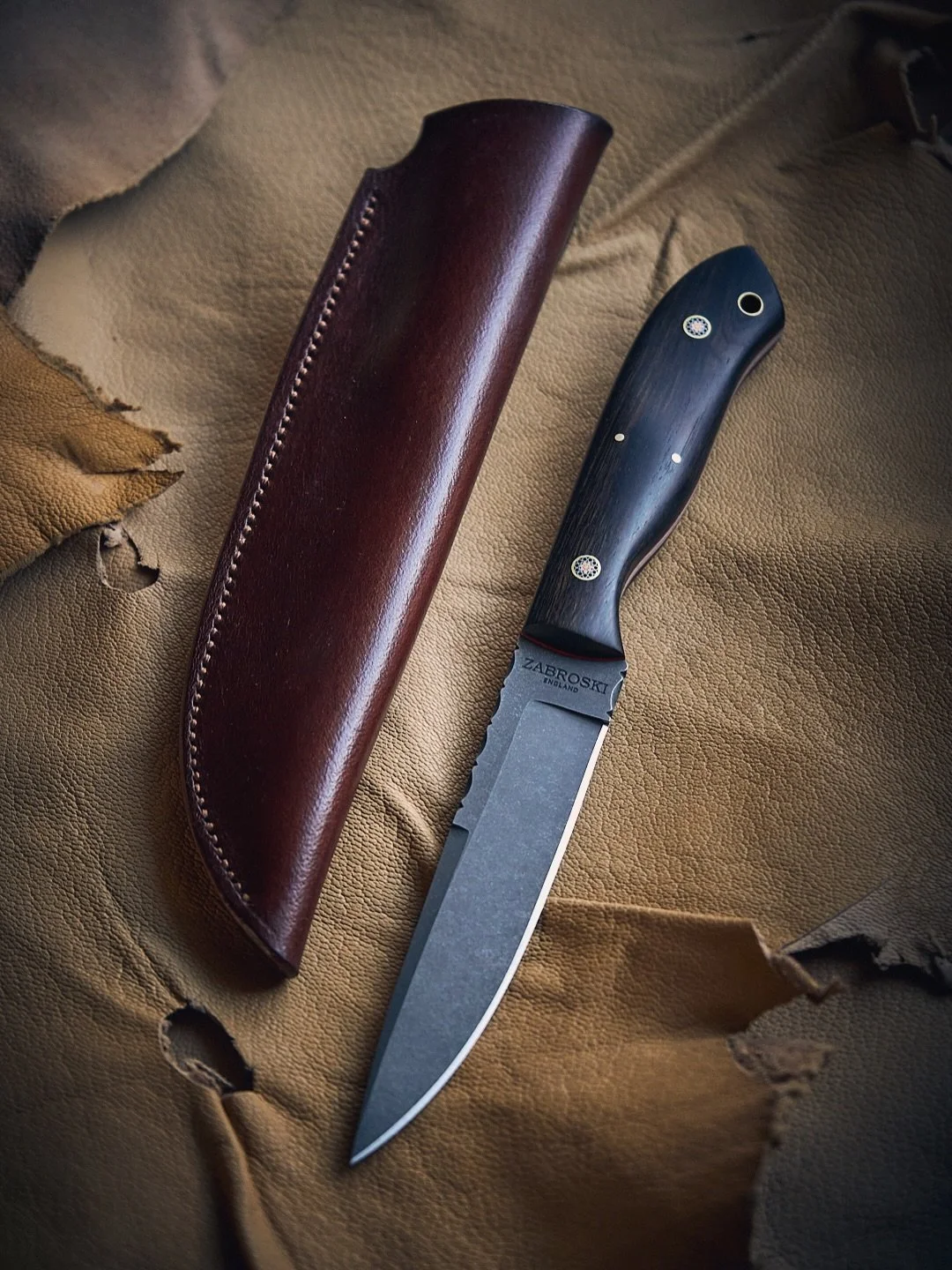 Knife of the Month ~ Dark Cavalier

5&rdquo; RWL34 stainless blade, acid stonewashed

African Blackwood lined in Cherry Red

Sheathed in Buffalo Leather

Available now ~ see website