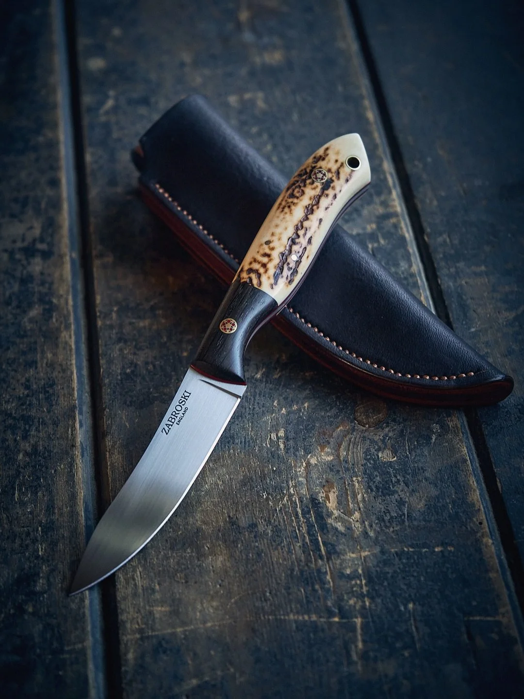 Balmoral

British SF100 stainless steel | Red Stag antler | Fenland Bog Oak | Poppy Red liners | Tudor Rose mosaic pins | Red deerskin sheath

Commission for an American former serviceman stationed locally - &ldquo;Something to remember my time in En