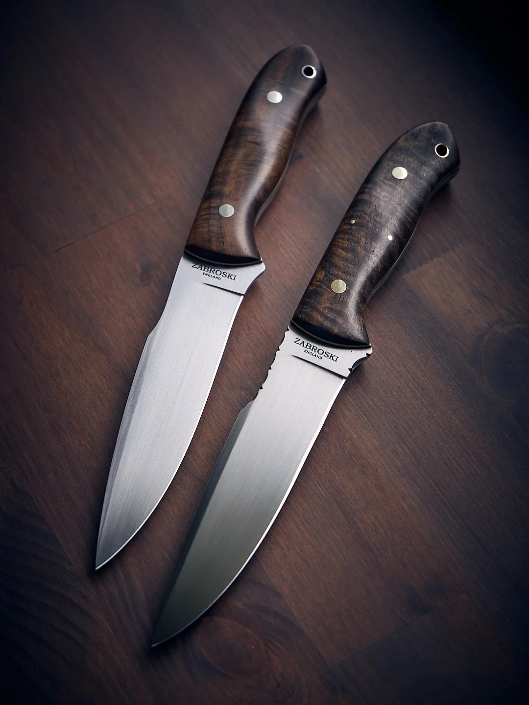 Mismatched pair of Explorer&rsquo;s &mdash; one clean and simple, the other fancier than a tick on a fat dog.