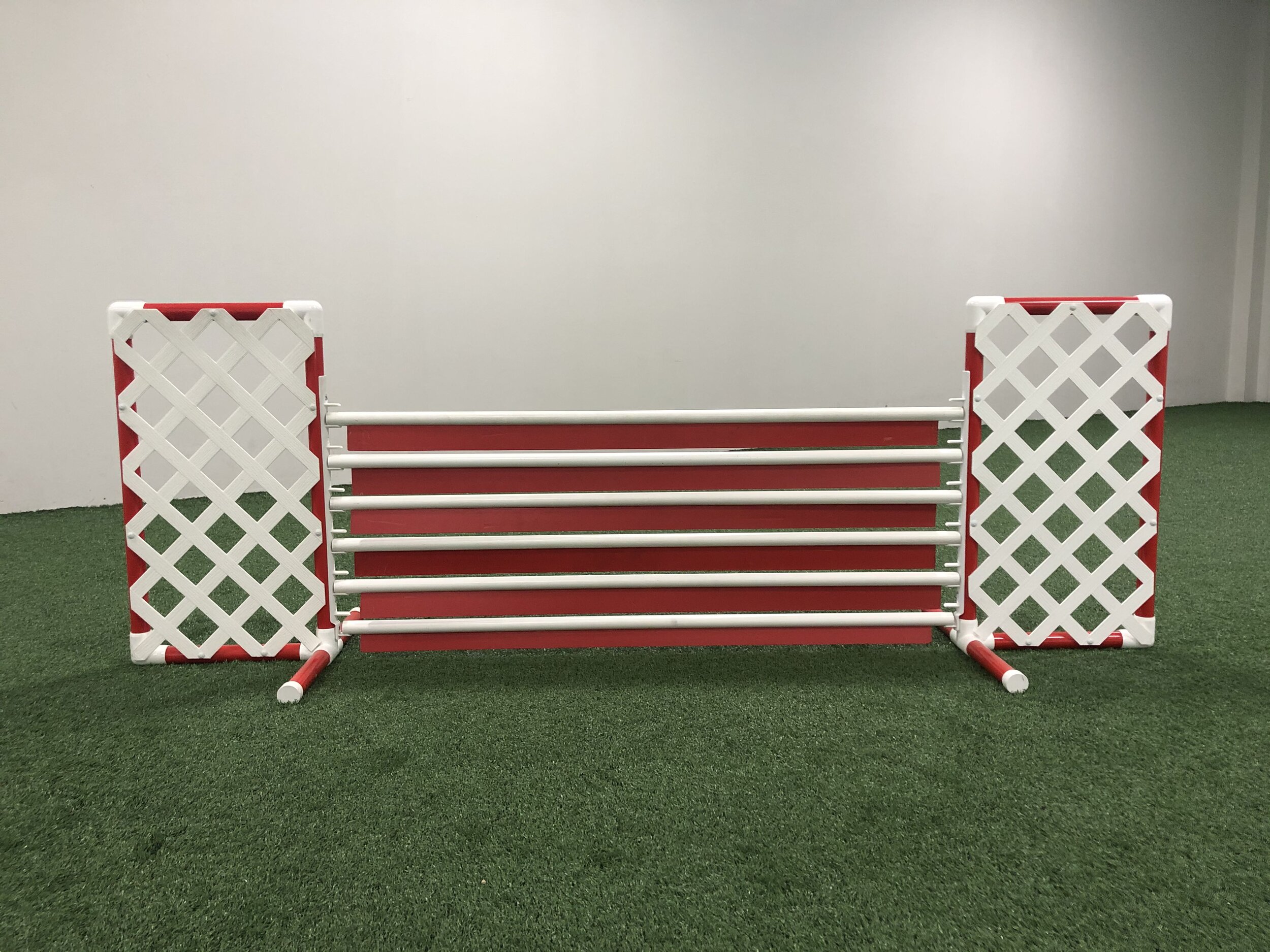 Winged Panel Jump15” wing width - $175 18” wing width - $185Constructed with 1 ¼” PVC colored pipe and white plastic latticeIncludes (2) wing uprights and (6) colored panelsComes with&nbsp;plastic jump cup strips from 4" to 26"Jump color options: Re…