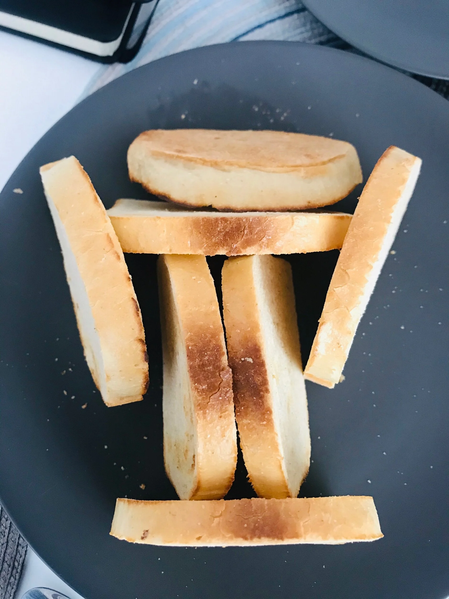 If we lay the toast down flat on the plate it gets soggy from condensation. It’s become a fun challenge for the toast maker to make a standing structure so it doesn’t get soggy.