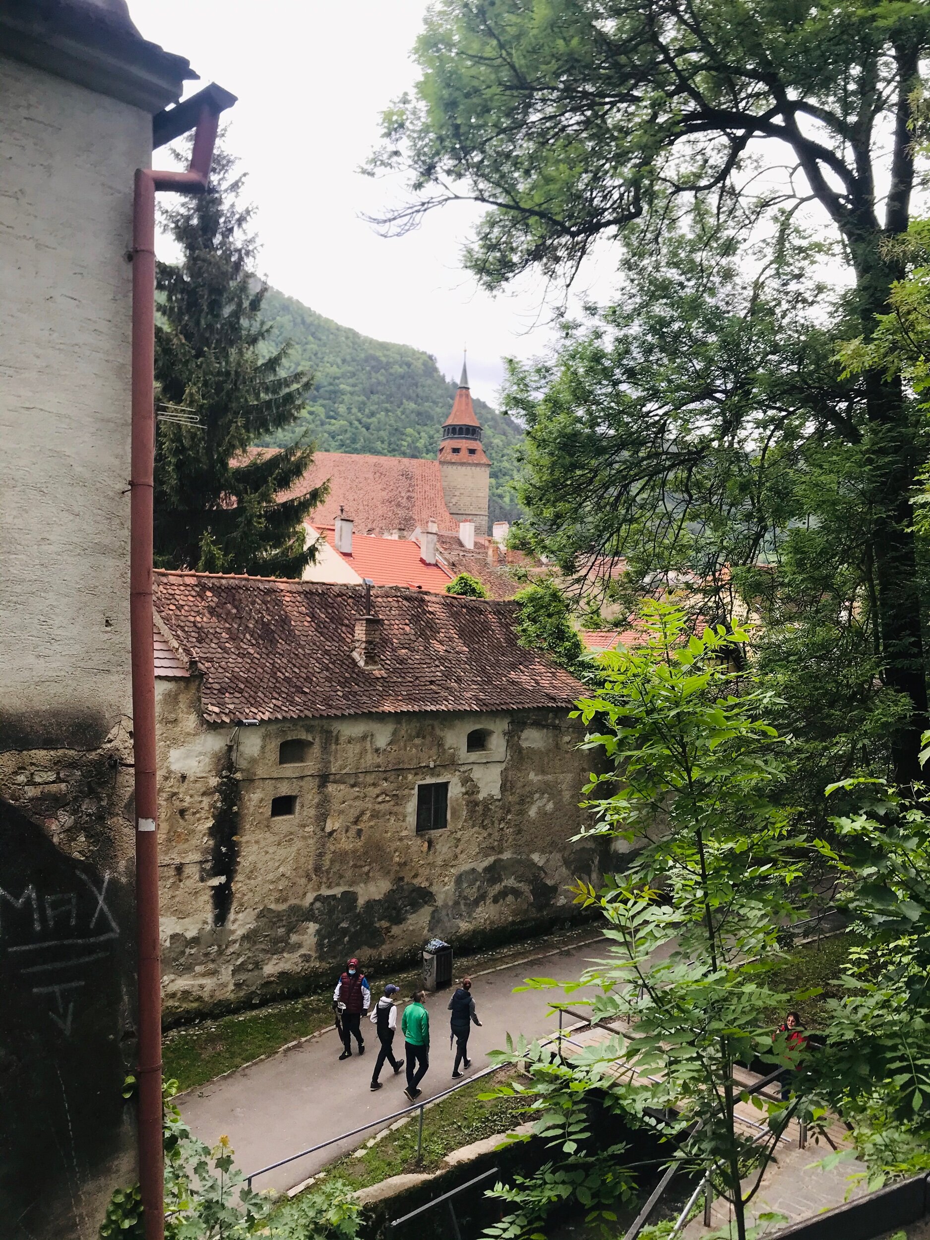 I believe the structure you see next to the people walking is part of the old city wall.