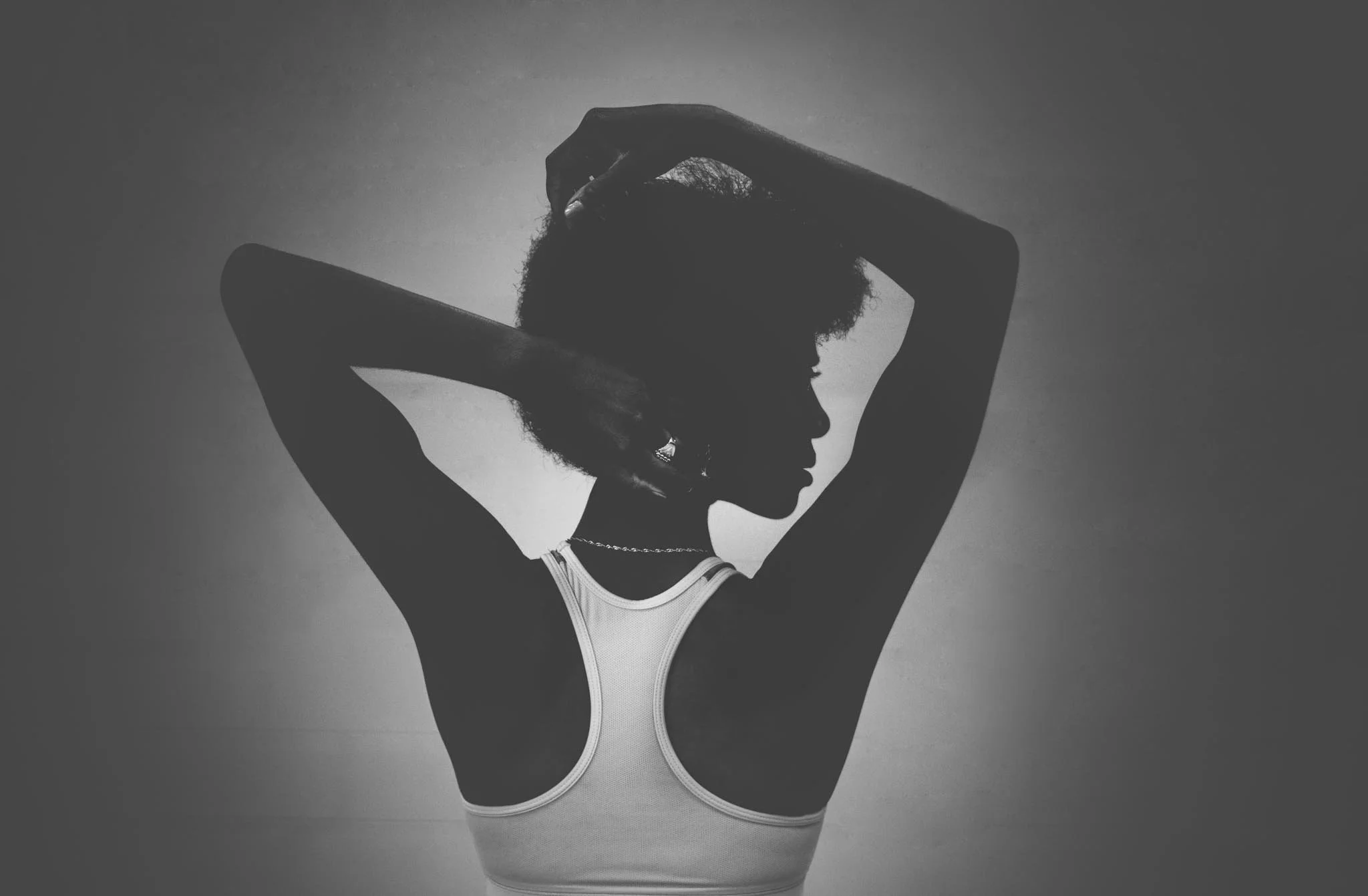 Black and White photo of Katlyn Addison facing away from the camera
