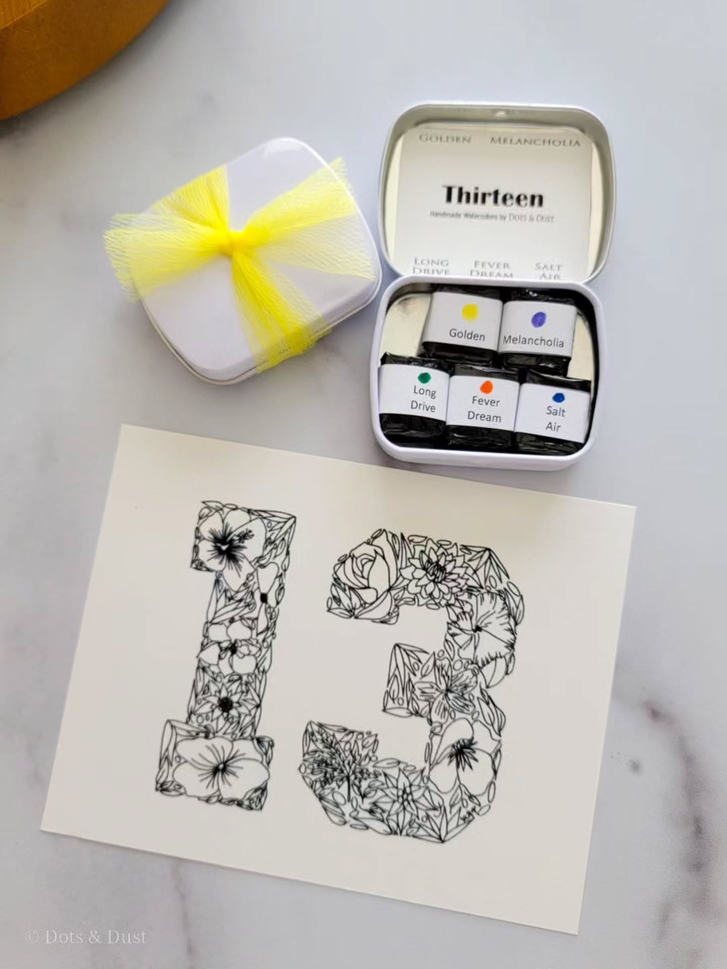 Since Taylor Swift is dropping her "Encore" tomorrow, I felt it may be fun to tell the story behind our handmade watercolor set, "Thirteen." 😁

The name for this watercolor set was chosen for a couple of reasons:

1) It was Dots 
