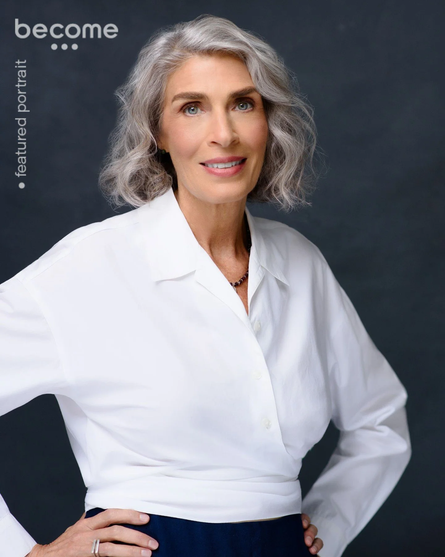 Another classic headshot&mdash;timeless in black &amp; white or full color.

This hand-painted dark gray backdrop is perfect for letting natural beauty shine&mdash;gorgeous gray hair, a crisp white wrap, and nothing to distract from the person in fro