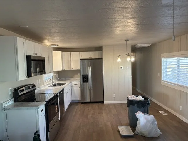 After: new floors; paint; fixtures, trim--new everything!